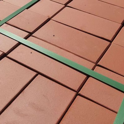 Manufacture of clay-fired roof tile system components, clay-fired paving bricks, ceramic panels, and clear water bricks for ground squares