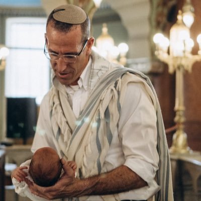 I am a father, surfer, rabbi, mohel, wedding officiant, and member of a private Beit Din in Israel