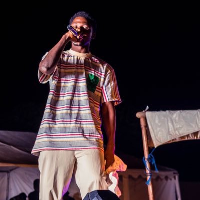 Kwesi Arhin is a dynamic music artist known for his captivating blend of Afroswing, hip pop, and rap. With a unique sound that fuses African rhythms with modern