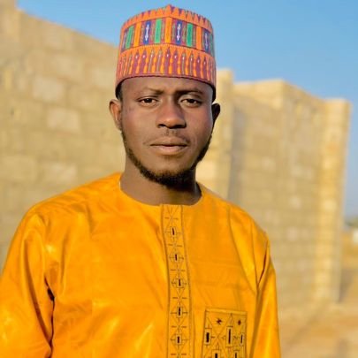 Born at Birchi Kurfi Local Government.