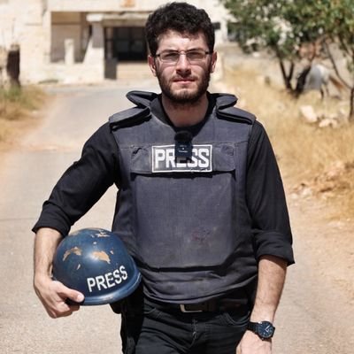 A Syrian  journalist 
who wants to see peace and freedom in his country.