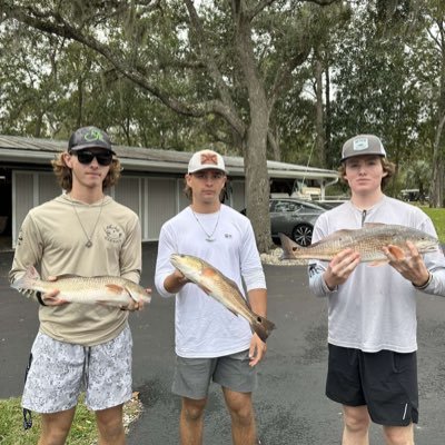 three boys trying to make a name for ourselves the best way we know how through fish