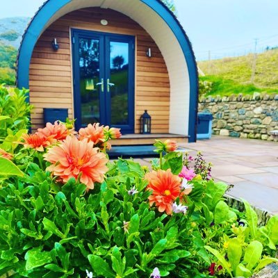 Two luxury Glamping pods, for two adults in each, situated at the foothills of the North Wales mountains, with breathtaking views of Snowdonia and the sea.