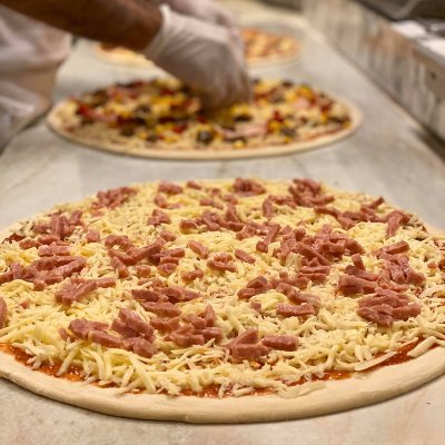 A slice of heaven, our pizzas are a culinary masterpiece.