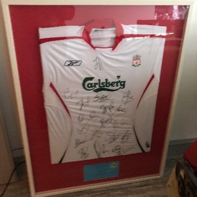 Guy who has a signed Liverpool shirt