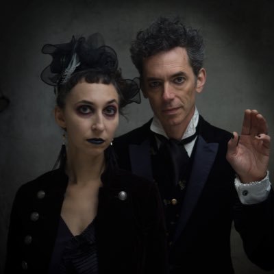 Goth-folk duo w/ songs about death, crime, myth, magic, science, & the occult. 