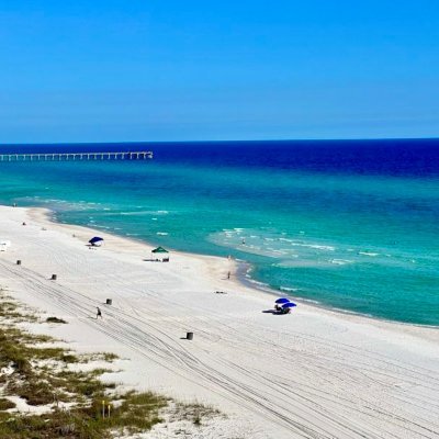 Sugar white sands, emerald green waters, and sun filled days await you in a gulf-front vacation rental on