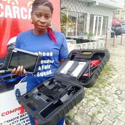 A female Auto Key Remotes , Brain Box, Gear Box Programmer