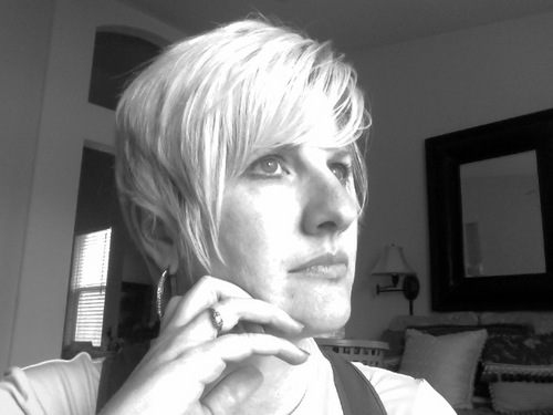 wife, mom of 4, singer, writer, champion of challenged, involuntary compulsive editor.