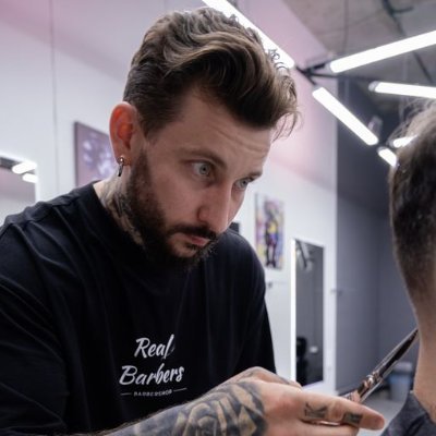 Welcome to the world of precision cuts and sharp styles! Join me, a seasoned barber at Real Barbers, as I craft modern looks with old-school flair.