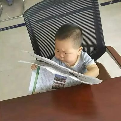 Busy at reading crypto tokens newspapers.