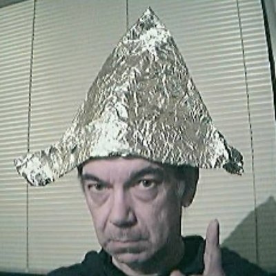 The history of tin foil hats dates to Sir Julian Huxley's 1926 work, noting metal caps reduced telepathic effects. 5NuZrSiCmHTPNX6cjxq9XRztx9CVQF3D2Mj7LELkGBeq