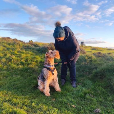 Poppy the littlest Airedale Terrier and her staff. Views are my own