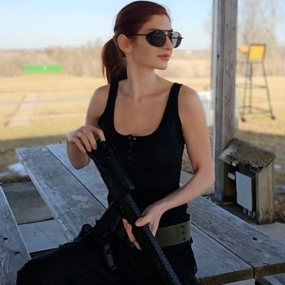 Gats, Cats, Bikes, and Bikinis. That's my entire brand. Also, I'm crazy, but not clinically, only in the most redhead of ways! 😊 I don't have an OF.
