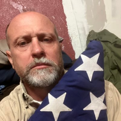 Dukeofsalem2's profile picture. We are in an InfoWar. I hold my dad’s folded flag. We served and will continue to fight evil. My oath is beyond death.