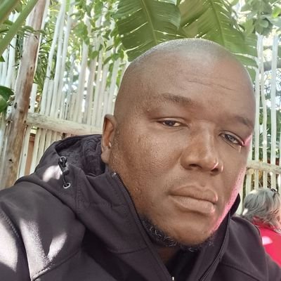 A gentle Giant. Ancestor. Traditionalist. Real Estate. Arsenal fan. Gin and wine . God first