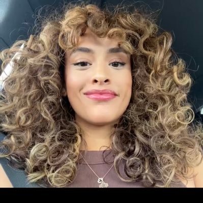 A curly headed goofball who likes popcorn and sports.