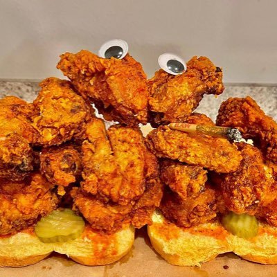 A smoking assortment of #Nashville #HotChicken 🍗 on top of bread 🍞 w/ #dillpickles 🥒 and big googly eyes 👀 $SHC #collardgreens #macandcheese 🇺🇸