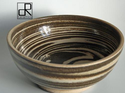 Australian potter Drew Robins lives in Curry Mallet, Somerset. My work is simply decorated functional pottery or decorative agateware pieces. Lessons available.