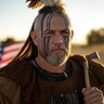 MADcHATTER5150's profile picture. Read Pinned 1st Military Dad. MAGA/MAHA Pure Blood, Pro-Life, Pro Constitution, Limited Govt & Gun owner. 1A/2A Native: Eksá:’a Tekariho:ken. Ken’kanienkaha:ka.