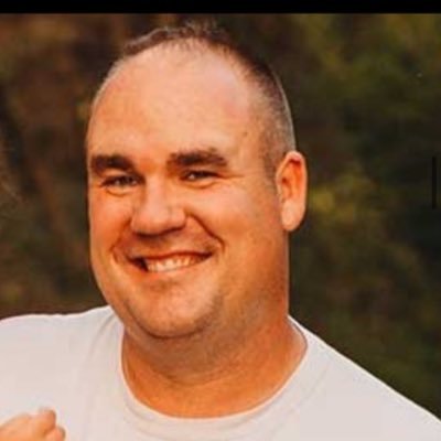 Dairy farmer and booth guy in a dinosaur football offense