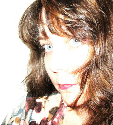 Graphic Designer, Scrapbooker, Mixed Media artist, Trainer who enjoys nothing more than a vacation with water