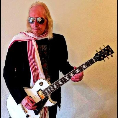 Howlin' Waters is a raw, blues-rock powerhouse electrifying stages with his soulful vocals and blistering guitar riffs.