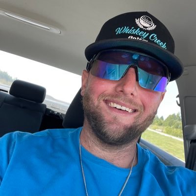 smirking like an asshole with a cheek full of tobacco
