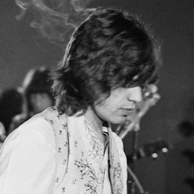hellish cherub, clad in stars and a charming grin. PARODY. . THE david bowie fan club leader.