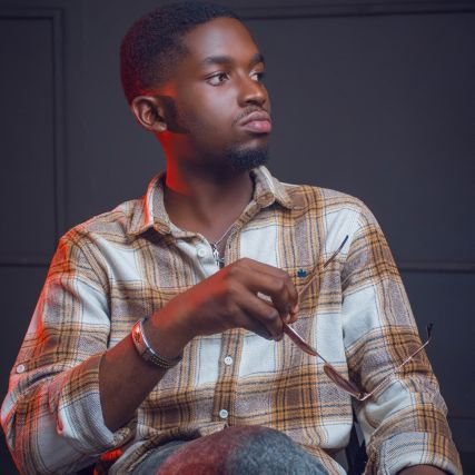 JohnKat___2304's profile picture. Graphic & Web Designer | Micro Entrepreneur | Ingénieur industriel en formation ESI-UNILU | Maestro au Mouvement Pueri Cantores.