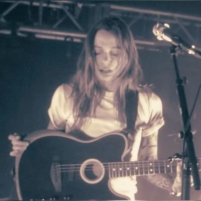 my only achievement in life is when julien baker pointed at me and i gave her a tiny guitar (7/30/23)🤭🤭