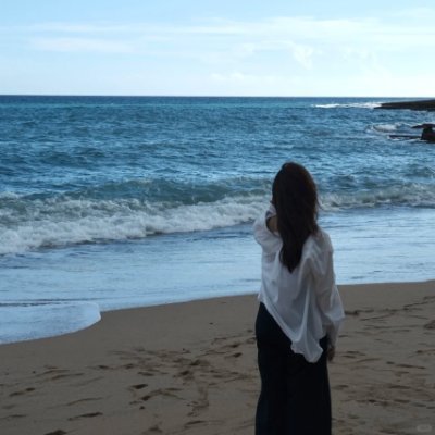 She stood silently on the shore of the sea... the sound of the waves was reaching her heart.