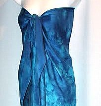 Custom fashion design & fibre art studio featuring beach, cruise & bridal wear. Signature item: shibori ombre hand painted silk sarong wrap dress