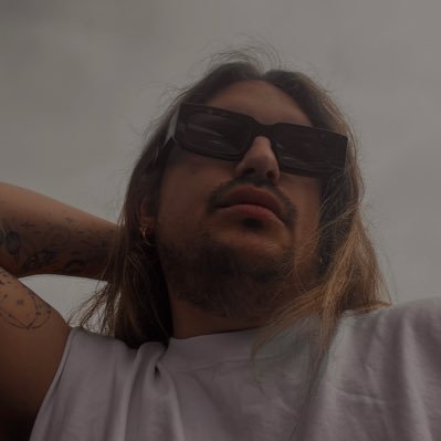 iyaajay's profile picture. tatted dog dad to an adorable chow chow with a terrible sense of humour