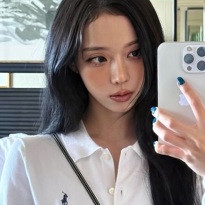 Kim Minjeong (born January 1, 2001) — a vision of elegance and serenity, her presence is as rare and captivating as the first snow.