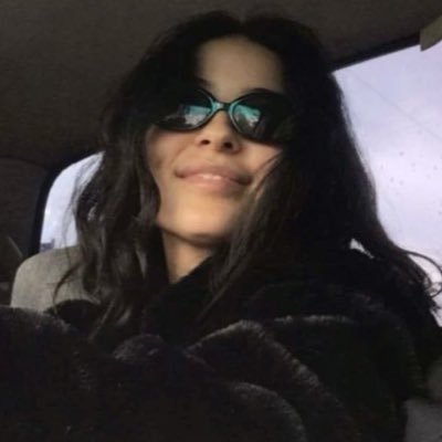 witchlingwaltz's profile picture. a young woman stays in bed, reads, talks on the phone, smokes cigarettes, and tries on some clothes from a large wardrobe https://t.co/3VMzlrJPia