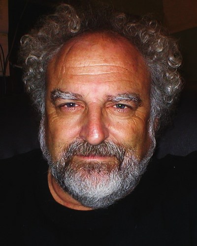 When I let my hair grow long some folk say I look like Albert Einstein what a compliment I prefer to Die on my feet than Live on my knees!