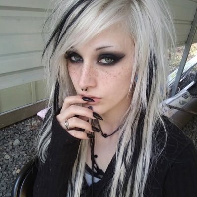 non-binary, witch, pagan, mother, introvert, song writer, artist, alien probably.