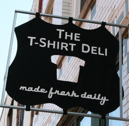 Serving made-to-order T-Shirts in a deli setting. Orders come wrapped in butcher paper with bag of chips. Order online or visit Chicago stores. #tshirtdeli
