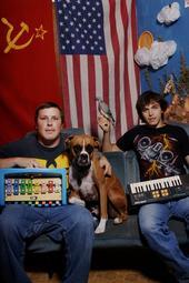 Transmography's profile picture. "...sticks its finger down the throat of synth pop..." AV Club