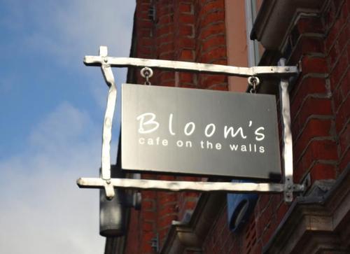 Maverick, opinionated but good matured bookseller and cafe owner Peter Mackenzie has taken over Café Blooms, the only Café on the walls.