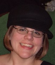 Librarian/Branch Manager, avid movie watcher, amateur foodie, pop culture junkie, and fan of all things pirate & zombie