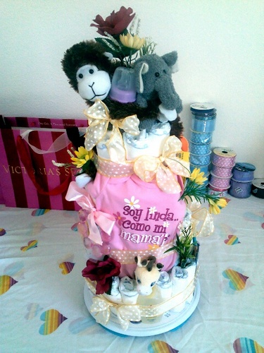 Hello, We're A2Z Baby Gifts. We spacialize in custom diaper cakes and gift baskets upon requests. for additional info. please Direct Message & Follow Us! (: