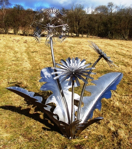 Metal sculpture of animals and plants.