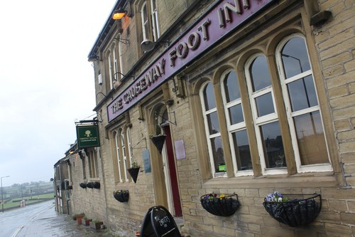 The Causeway Foot Inn is a friendly country inn and restaurant located to the north of Halifax, complete with leather armchairs and blazing log fires.