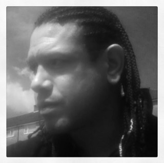 chriscox187's profile picture. Wears odd socks and got dread locks