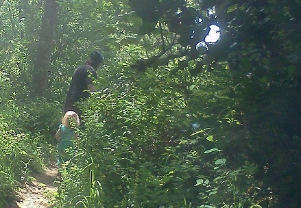 Mom biking quietly through the woods