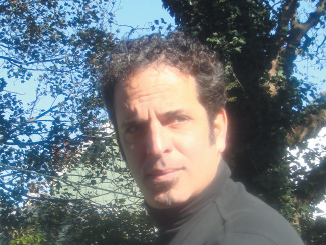 Tom Trabulsi was born in the Midwest, attended high school in Rhode Island, and graduated from Boston University.