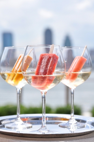 A seasonal rooftop terrace bar serving innovative cocktails and providing stunning views of the Statue of Liberty and New York Harbor.
