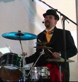 A maniac behind the set; a mensch behind the wheel, and a maker behind the scenes.  Teddy Bash drums.  On Spoutable saying drum stuff.